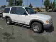 1999 Ford Explorer XL with VIN 1FMZU32X8XZB64735, listed as a Copart auction lot 82251585 with 189,401 mi miles and Salvage title. Bid and sale history available at DreamBid. Image 4.