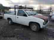 1991 Nissan Frontier z VIN 1N6SD11S6MC313056, wystawiony jako Copart lot #87491734 z przebiegiem 141 461 mil mil oraz Czysty tytuł • Clean title. Historia ofert i sprzedaży dostępna na DreamBid. Obrazek 4.