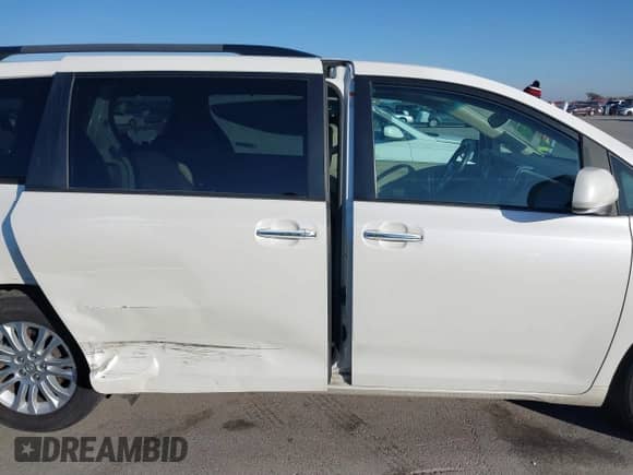 2016 Toyota Sienna XLE with VIN 5TDYK3DC6GS758189, listed as a IAAI auction lot 41598251 with 129,050 mi miles and . Bid and sale history available at DreamBid. Image 13.
