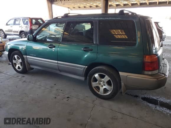 1999 Subaru Forester S with VIN JF1SF6557XG746774, listed as a Copart auction lot 66852165 with 345,706 mi miles and Clean title. Bid and sale history available at DreamBid. Image 2.