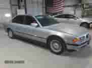 1997 BMW 7 Series 740iL with VIN WBAGJ8321VDM03554, listed as a Copart auction lot 71351095 with 143,449 mi miles and Salvage title. Bid and sale history available at DreamBid. Image 4.