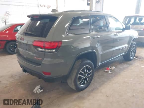 2020 Jeep Grand Cherokee Trailhawk with VIN 1C4RJFLG6LC101899, listed as a IAAI auction lot 42592283 with 116,619 mi miles and . Bid and sale history available at DreamBid. Image 4.