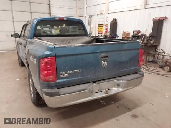 2005 Dodge Dakota SLT with VIN 1D7HW48KX5S306252, listed as a IAAI auction lot 41399238 with 140,474 mi miles and . Bid and sale history available at DreamBid. Image 3.