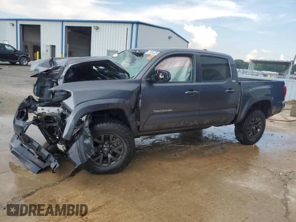 2021 Toyota Tacoma SR5 with VIN 5TFAZ5CN7MX106070, listed as a Copart auction lot 66659945 with 88,319 mi miles and Salvage title. Bid and sale history available at DreamBid. Image 1.