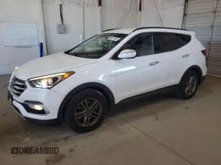 2018 Hyundai Santa Fe 2.4L z VIN 5NMZU3LB5JH089074, wystawiony jako Copart lot #86227655 z przebiegiem 84 861 mil mil oraz Szkoda całkowita • Salvage title. Historia ofert i sprzedaży dostępna na DreamBid. Obrazek 1.