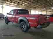 2002 Nissan Frontier XE with VIN 1N6ED26T52C341691, listed as a Copart auction lot 52446055 with 271,761 mi miles and Salvage title. Bid and sale history available at DreamBid. Image 2.