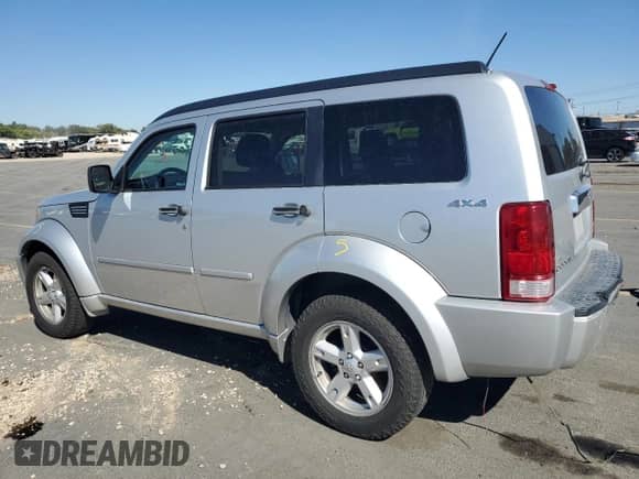 2011 Dodge Nitro SXT with VIN 1D4PU5GKXBW579119, listed as a Copart auction lot 84003925 with 185,345 mi miles and Salvage title. Bid and sale history available at DreamBid. Image 2.