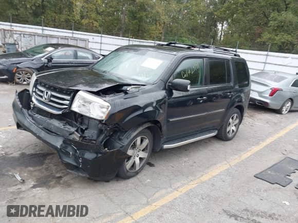 2013 Honda Pilot Touring with VIN 5FNYF4H97DB047819, listed as a IAAI auction lot 43299908 with 253,413 mi miles and . Bid and sale history available at DreamBid. Image 2.
