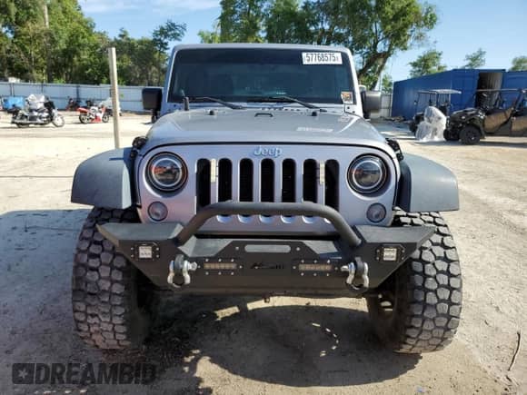 2014 Jeep Wrangler Sport with VIN 1C4AJWAG0EL126249, listed as a Copart auction lot 57768575 with 136,981 mi miles and Salvage title. Bid and sale history available at DreamBid. Image 5.