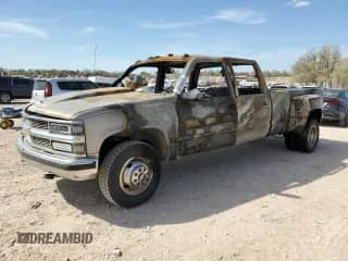 1999 Chevrolet Silverado 3500 с VIN 1GCHC33J2XF038028, выставлен на аукционе Copart как лот 50646935 с пробегом Не указан миль и На запчасти • Non repairable. История ставок и продаж доступна на DreamBid. Изображение 1.