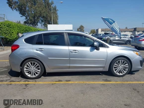 2012 Subaru Impreza Premium z VIN JF1GPAD64CH215617, wystawiony jako IAAI lot #43345861 z przebiegiem 157 056 mil mil oraz . Historia ofert i sprzedaży dostępna na DreamBid. Obrazek 14.