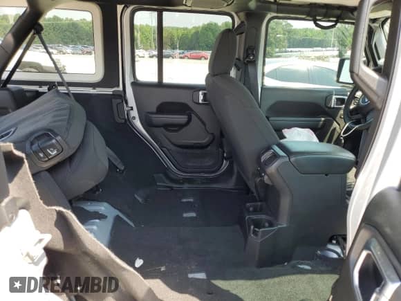 2023 Jeep Wrangler Willys with VIN 1C4HJXDG5PW653950, listed as a Copart auction lot 61857165 with 19,633 mi miles and Salvage title. Bid and sale history available at DreamBid. Image 11.