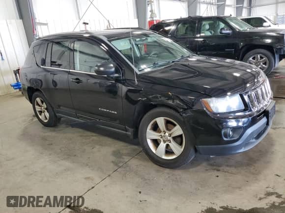 2014 Jeep Compass Sport with VIN 1C4NJDBB9ED842554, listed as a Copart auction lot 69468485 with 124,308 mi miles and Salvage title. Bid and sale history available at DreamBid. Image 4.
