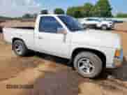 1995 Nissan Frontier z VIN 1N6SD11S4SC421012, wystawiony jako Copart lot #81146785 z przebiegiem 129 528 mil mil oraz Szkoda całkowita • Salvage title. Historia ofert i sprzedaży dostępna na DreamBid. Obrazek 4.