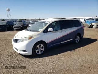2011 Toyota Sienna LE AAS with VIN 5TDKK3DC9BS134854, listed as a Copart auction lot 90408435 with 127,829 mi miles and Clean title. Bid and sale history available at DreamBid. Image 1.