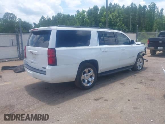 2015 Chevrolet Suburban LT z VIN 1GNSCJKC3FR598528, wystawiony jako IAAI lot #42572084 z przebiegiem 135 002 mil mil oraz . Historia ofert i sprzedaży dostępna na DreamBid. Obrazek 4.