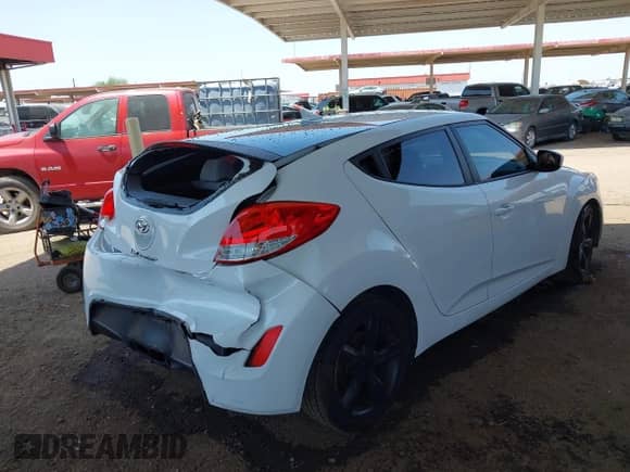2014 Hyundai Veloster with VIN KMHTC6ADXEU209850, listed as a IAAI auction lot 42726384 with 128,523 mi miles and . Bid and sale history available at DreamBid. Image 4.