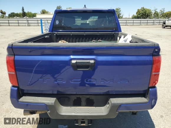 2024 Toyota Tacoma SR5 with VIN 3TMKB5FN4RM003206, listed as a Copart auction lot 64324035 with 8,012 mi miles and Salvage title. Bid and sale history available at DreamBid. Image 6.
