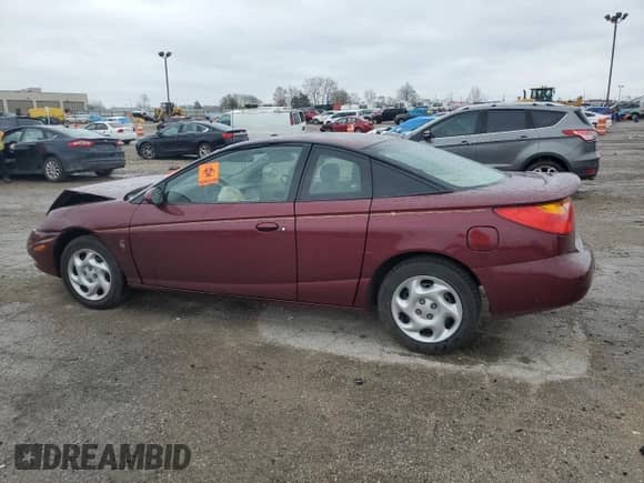 2002 Saturn SC with VIN 1G8ZY12732Z176596, listed as a Copart auction lot 50506894 with Not provided miles and Salvage title. Bid and sale history available at DreamBid. Image 2.