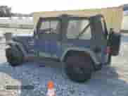 2000 Jeep Wrangler Sport with VIN 1J4FA49S5YP744967, listed as a Copart auction lot 67909665 with 141,990 mi miles and Clean title. Bid and sale history available at DreamBid. Image 2.