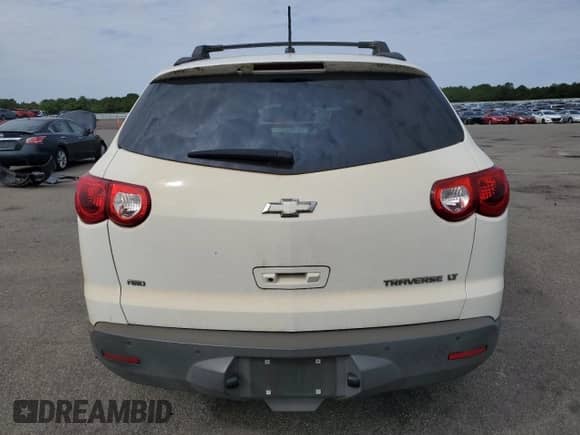 2012 Chevrolet Traverse 1LT с VIN 1GNKVGED0CJ388187, выставлен на аукционе Copart как лот 80297115 с пробегом 87 578 миль миль и Списание • Salvage title. История ставок и продаж доступна на DreamBid. Изображение 6.