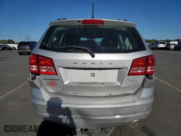 2014 Dodge Journey American Value with VIN 3C4PDCAB8ET164207, listed as a Copart auction lot 83757795 with 157,477 mi miles and Salvage title. Bid and sale history available at DreamBid. Image 6.