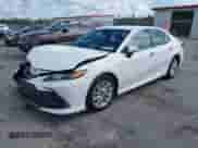 2021 Toyota Camry LE with VIN 4T1C11AK8MU601313, listed as a IAAI auction lot 43383218 with 34,384 mi miles and . Bid and sale history available at DreamBid. Image 2.