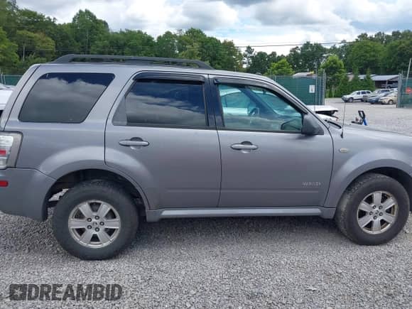 2008 Mercury Mariner with VIN 4M2CU91178KJ14388, listed as a IAAI auction lot 42973382 with 219,954 mi miles and . Bid and sale history available at DreamBid. Image 13.