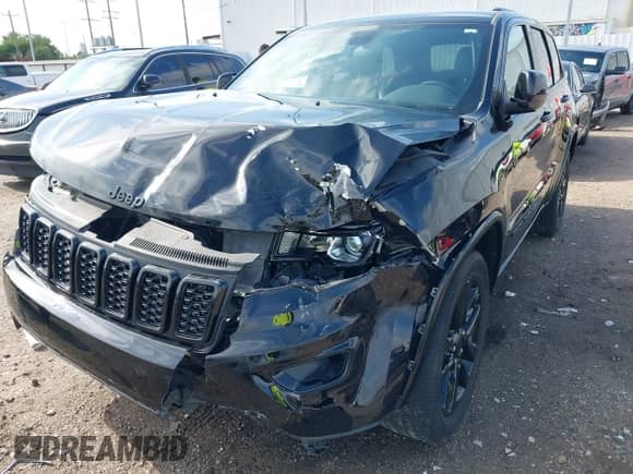 2021 Jeep Grand Cherokee Laredo E with VIN 1C4RJEAG0MC571375, listed as a IAAI auction lot 42087648 with 29,358 mi miles and . Bid and sale history available at DreamBid. Image 6.