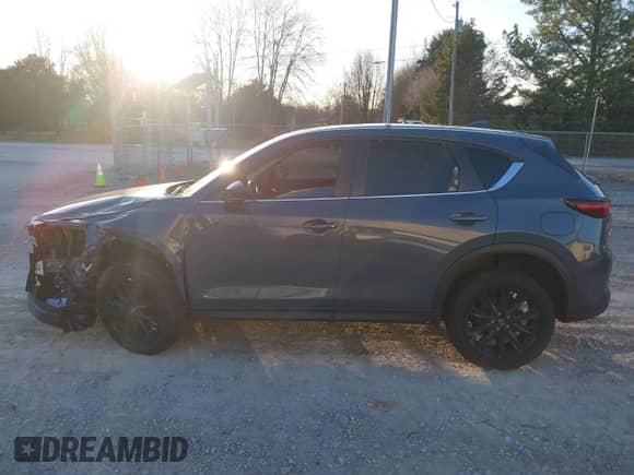 2022 Mazda CX-5 S Carbon Edition z VIN JM3KFBCM3N0537011, wystawiony jako IAAI lot #41472429 z przebiegiem 31 498 mil mil oraz . Historia ofert i sprzedaży dostępna na DreamBid. Obrazek 14.