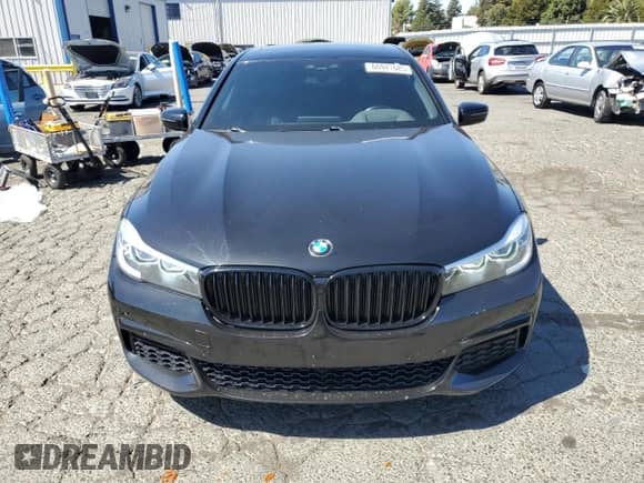 2018 BMW 7 Series 740i с VIN WBA7E2C55JG743181, выставлен на аукционе Copart как лот 66941685 с пробегом 104 612 миль миль и Списание • Salvage title. История ставок и продаж доступна на DreamBid. Изображение 5.