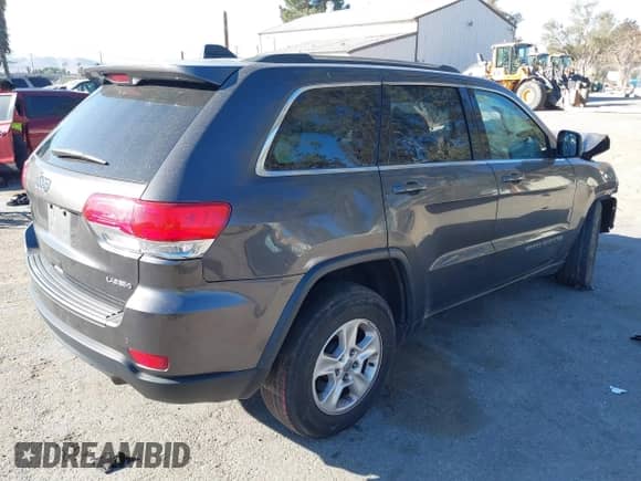 2017 Jeep Grand Cherokee Laredo with VIN 1C4RJEAG8HC944037, listed as a IAAI auction lot 41299619 with 140,405 mi miles and . Bid and sale history available at DreamBid. Image 4.