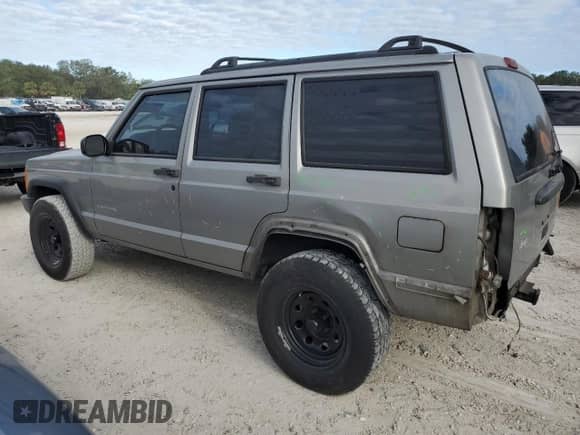 2000 Jeep Grand Cherokee with VIN 1J4FT28P7YL157642, listed as a Copart auction lot 80967794 with 174,654 mi miles and Salvage title. Bid and sale history available at DreamBid. Image 2.