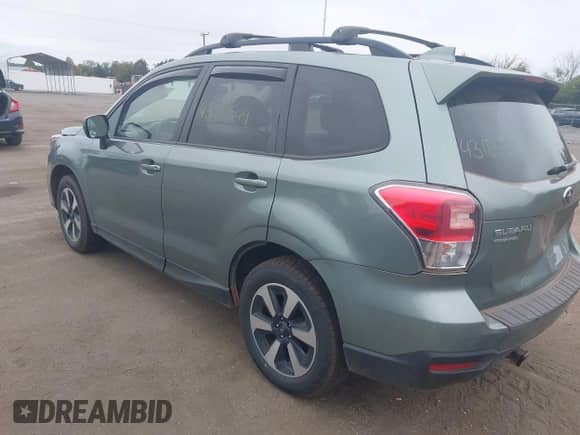 2018 Subaru Forester Premium z VIN JF2SJAEC2JH586302, wystawiony jako IAAI lot #43186549 z przebiegiem 122 233 mil mil oraz . Historia ofert i sprzedaży dostępna na DreamBid. Obrazek 3.