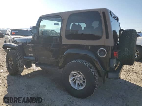 1999 Jeep Wrangler Sahara with VIN 1J4FY49S9XP479545, listed as a Copart auction lot 54753745 with 34,642 mi miles and Salvage title. Bid and sale history available at DreamBid. Image 2.