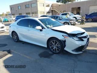 2021 Toyota Camry Hybrid XLE with VIN 4T1F31AK3MU567000, listed as a IAAI auction lot 43279629 with 132,796 mi miles and . Bid and sale history available at DreamBid. Image 1.