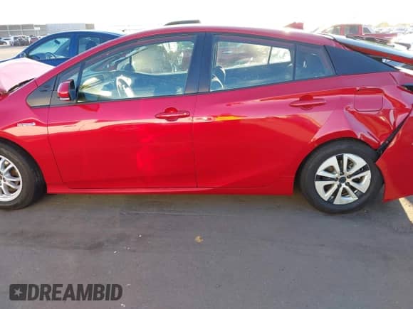 2021 Toyota Prius L Eco with VIN JTDKAMFU6M3152201, listed as a IAAI auction lot 43278670 with 144,414 mi miles and . Bid and sale history available at DreamBid. Image 14.