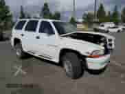1999 Dodge Durango with VIN 1B4HS28Y1XF573528, listed as a Copart auction lot 71499974 with 118,012 mi miles and Salvage title. Bid and sale history available at DreamBid. Image 4.