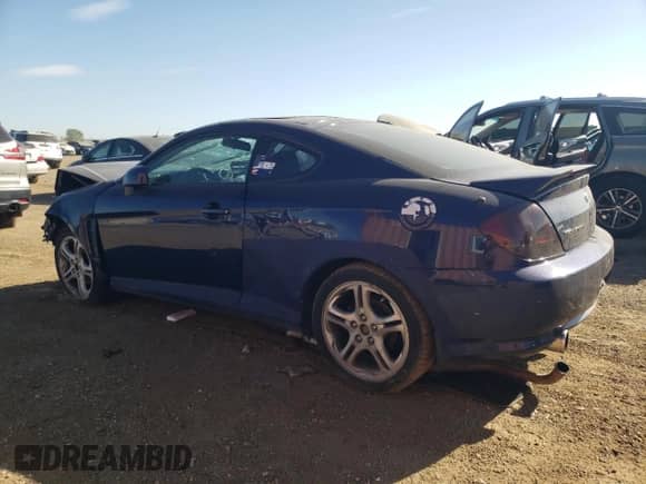 2006 Hyundai Tiburon GS с VIN KMHHM65D96U229490, выставлен на аукционе Copart как лот 74692004 с пробегом Не указан миль и Списание • Salvage title. История ставок и продаж доступна на DreamBid. Изображение 2.