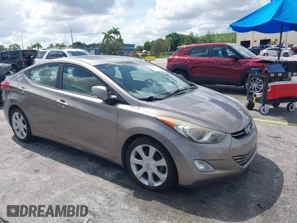 2013 Hyundai Elantra GLS z VIN 5NPDH4AE7DH175334, wystawiony jako IAAI lot #42987177 z przebiegiem 158 624 mil mil oraz . Historia ofert i sprzedaży dostępna na DreamBid. Obrazek 1.