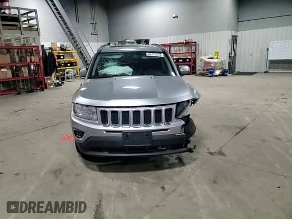 2016 Jeep Compass Latitude with VIN 1C4NJDEBXGD721806, listed as a Copart auction lot 86772214 with 137,065 mi miles and Salvage title. Bid and sale history available at DreamBid. Image 12.