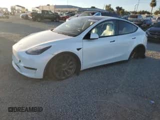 2023 Tesla Model Y Performance z VIN 7SAYGDEF4PF964926, wystawiony jako Copart lot #84703235 z przebiegiem 87 399 mil mil oraz Czysty tytuł • Clean title. Historia ofert i sprzedaży dostępna na DreamBid. Obrazek 1.