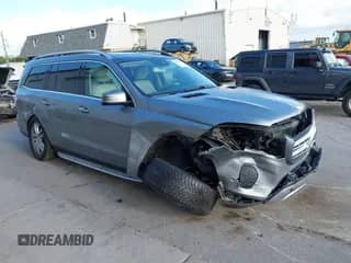 2017 Mercedes-Benz GLS 450 with VIN 4JGDF6EE6HA770387, listed as a IAAI auction lot 43050470 with 104,872 mi miles and . Bid and sale history available at DreamBid. Image 1.