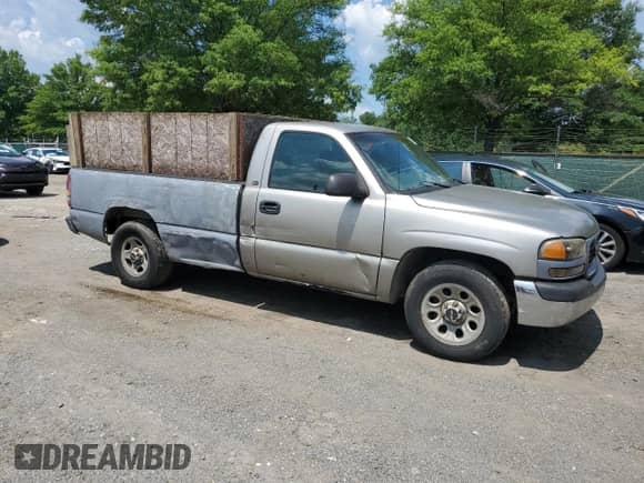2001 GMC Sierra 1500 SL with VIN 1GTEC14W21Z187496, listed as a Copart auction lot 63243275 with 251,682 mi miles and Salvage title. Bid and sale history available at DreamBid. Image 4.