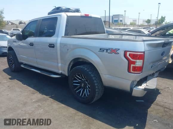 2018 Ford F-150 XL with VIN 1FTEW1CP1JKD34689, listed as a IAAI auction lot 42899519 with 127,980 mi miles and . Bid and sale history available at DreamBid. Image 3.