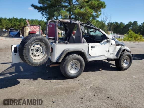 1997 Jeep Wrangler SE с VIN 1J4FY29P7VP526522, выставлен на аукционе Copart как лот 80190625 с пробегом 187 292 миль миль и Списание • Salvage title. История ставок и продаж доступна на DreamBid. Изображение 3.
