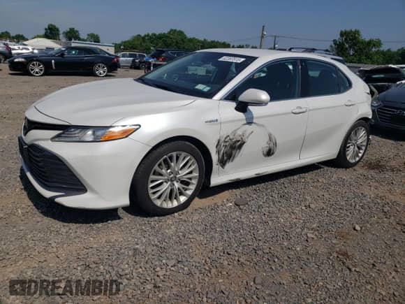 2019 Toyota Camry Hybrid LE с VIN 4T1B21HK5KU014272, выставлен на аукционе Copart как лот 62397815 с пробегом 59 834 миль миль и Списание • Salvage title. История ставок и продаж доступна на DreamBid. Изображение 1.