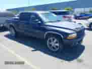 2002 Dodge Dakota Sport z VIN 1B7HL38X12S700825, wystawiony jako IAAI lot #42881583 z przebiegiem 199 484 mil mil oraz . Historia ofert i sprzedaży dostępna na DreamBid. Obrazek 1.