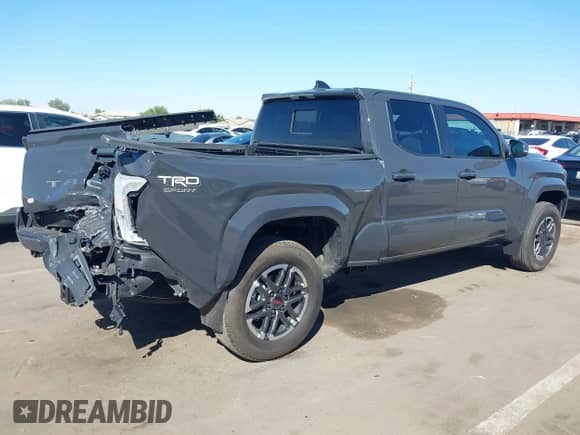 2024 Toyota Tacoma SR5 with VIN 3TMLB5FN8RM005075, listed as a IAAI auction lot 43290415 with 20,318 mi miles and . Bid and sale history available at DreamBid. Image 4.