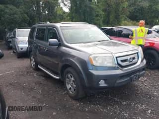 2010 Honda Pilot Touring with VIN 5FNYF4H97AB020406, listed as a IAAI auction lot 43138616 with 115,364 mi miles and . Bid and sale history available at DreamBid. Image 1.